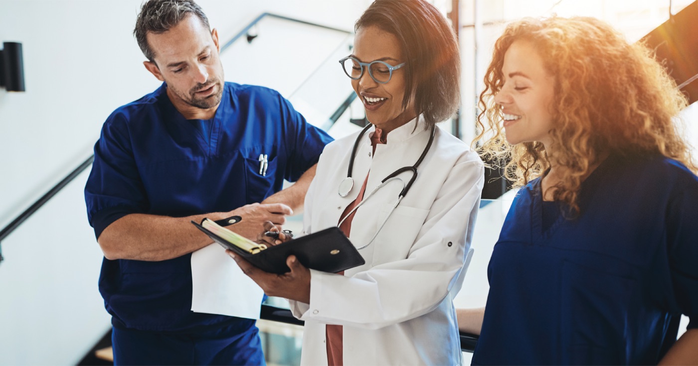 Clinicians reviewing a chart together